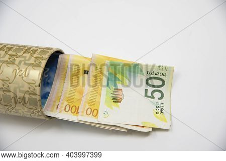 Metal Piggy Bank With New Israel Shekel Symbols For Saving Money. On A White Background With Nis Ban