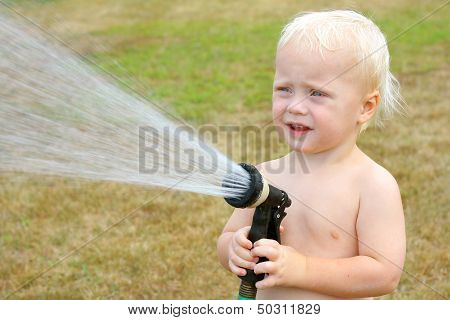 Baby Playing With Garden Hose