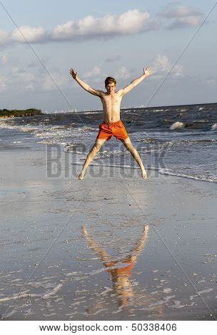 Teenager Enjoys Jogging Along The Beach