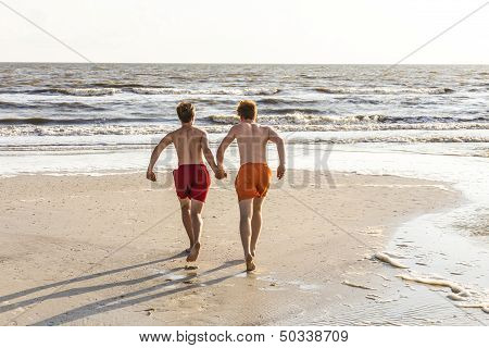 Teenager Enjoys Jogging Along The Beach