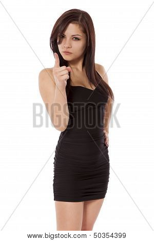 Young Woman In A Little Black Dress Points With Anger.