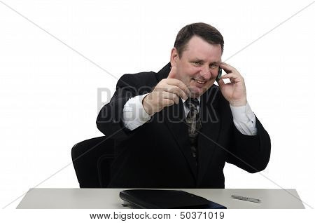 Cheerful Middle-aged Businessman Talking On The Phone