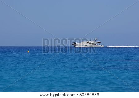 Speeding luxury boat / yacht on the blue sea