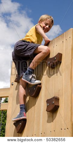 Young boy on a climbing wall