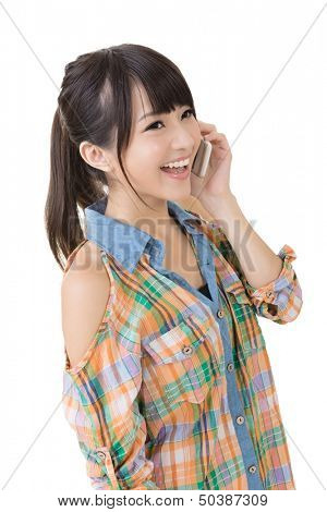 Young pretty asian woman talking on a cell phone. Half length potrtait. Isolated on the white background.