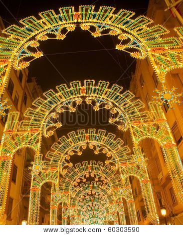 Beautiful night lights in Fallas fest of Valencia in calle Sueca street Spain