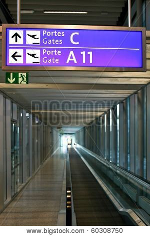 GENEVE-JANUARY 04: Empty Geneve airport with a blue airport sign to departure gates   inside airport hall in Switzerland on January 04, 2013.
