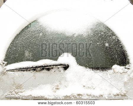 Car Windshield Covered With Snow