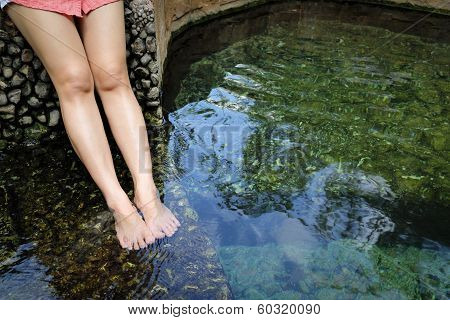 Women Legs Enjoys With Hot Springs Water