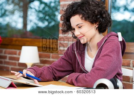 Young Girl Working On Tablet.