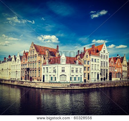 Vintage retro hipster style travel image of Benelux travel  concept background - Bruges canal and medieval houses. Brugge, Belgium