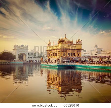 Vintage retro hipster style travel image of famous India attraction Sikh gurdwara Golden Temple (Harmandir Sahib). Amritsar, Punjab, India