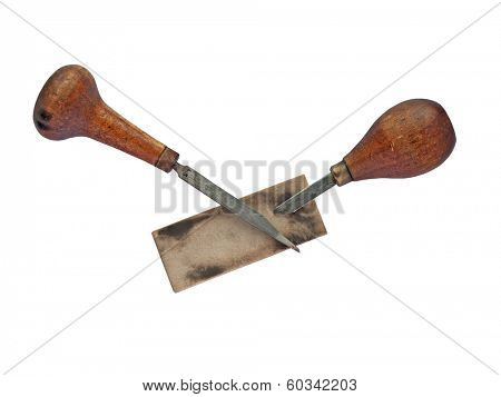 vintage gravers over sharpening stone, clipping path