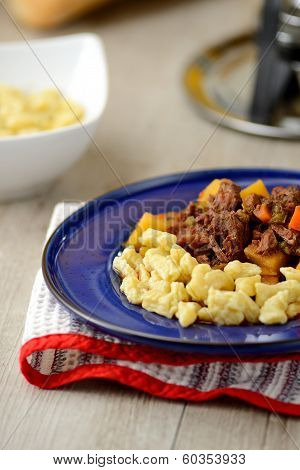 typical Hungarian dish with meat goulash and dumplings