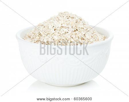 Oat flakes in bowl. Isolated on white background