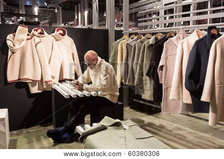 Exhibitor In His Stand At Mipap Trade Show In Milan, Italy