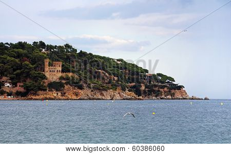Castell D'en Plaja Situated At The End Of The Sa Caleta Beach In Lloret De Mar, Costa Brava, Spain