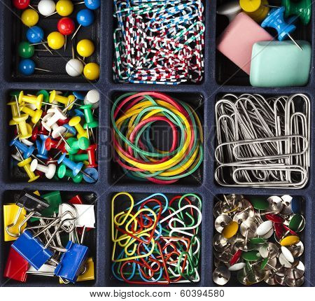 collection of various stationery in black box surface top view