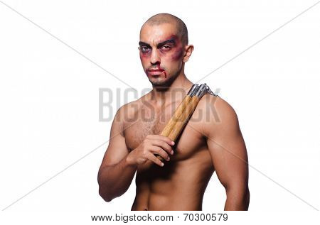Man with nunchucks isolated on white