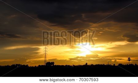 Sunset Over The Forests And Poles For High Voltage.