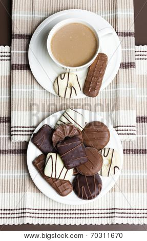 cup of coffee with chocolete biscuits