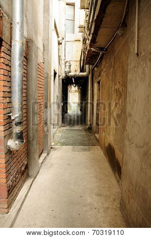 A narrow industrial alley way
