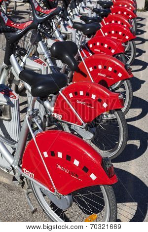 LYON FRANCE - AUGUST 2014 - Shared bikes are lined up in the streets of Lyons France. Velo'v Grand Lyon launched in May 2005 has over 340 stations and 3000 bikes throughout the Grand Lyon area.