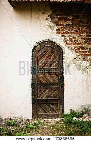 Old Medieval Door In The Destroyed Building