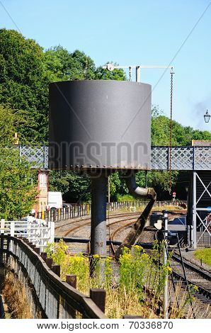Water tower alongside railway line.