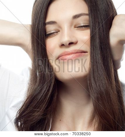 closeup portrait of attractive  caucasian smiling woman brunette isolated on white studio shot lips toothy smile face hair head and shoulders eyes closed ears closed by hands businesswoman