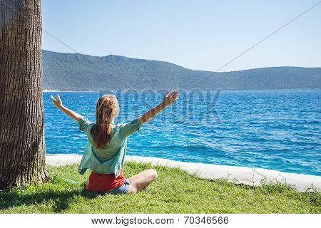 Woman sitting at the beach