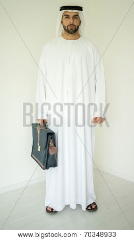 Arabic young businessman posing with bag