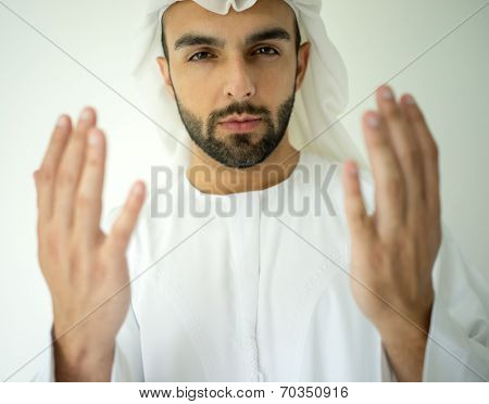 Arabic Muslim young man praying