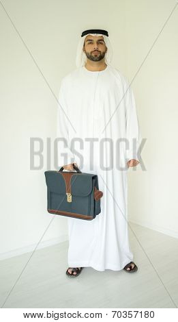 Arabic young businessman posing with bag