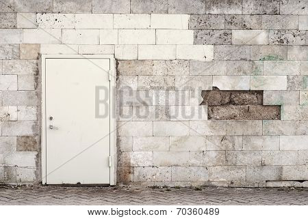 metal door and brik wall