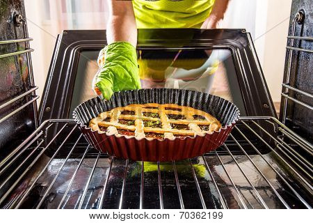 Housewife preparing cakes in the oven at home, view from the inside of the oven. Cooking in the oven.