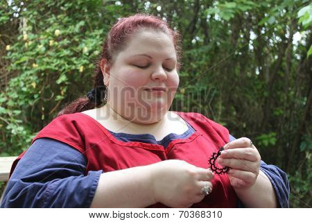 MUSKOGEE, OK - MAY 24: Women show art of lace making, as it was made in the Middle Ages, at the Oklahoma 19th annual Renaissance Festival on May 24, 2014 at the Castle of Muskogee in Muskogee, OK 