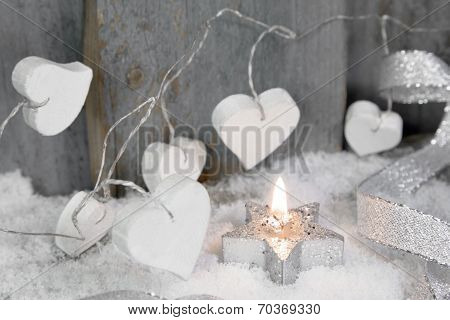 Christmas Candle In White With Hearts, Wood And Snow For Decoration