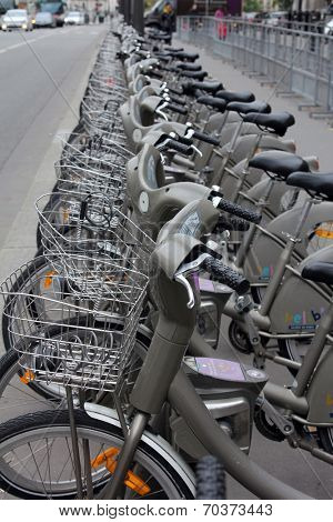 PARIS, FRANCE - NOVEMBER 07, 2012: Velib bucycles in the row on November 07, 2012 in Paris, France. Velib is a large-scale public bicycle sharing system in Paris.