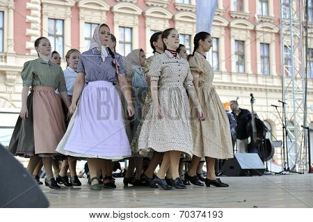 ZAGREB, CROATIA - JULY 19: Members of folk groups Nograd  from Salgotarjan, Hungary during the 48th International Folklore Festival in center of Zagreb, Croatia on July 19, 2014
