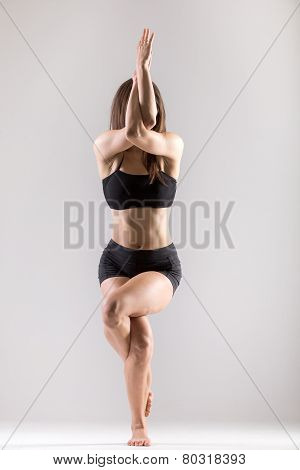 Yogi Gymnast Girl Doing Asana Garudasana, Eagle Pose