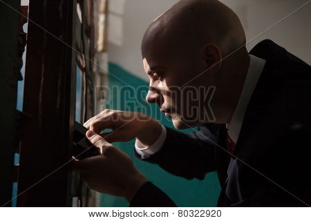 Bald Hitman Is Going To Open The Door With The Master Keys.