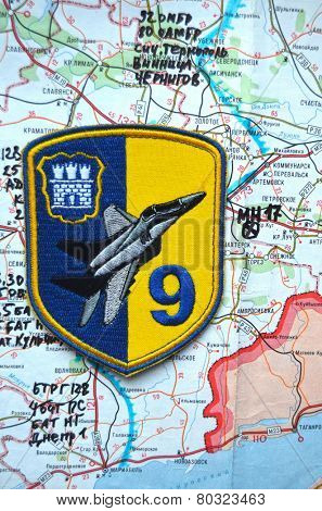 Illustrative editorial.Chevron of Ukrainian air force. 9 Aviation brigade.Estern Ukraine map with site MH-17 flight crush as background. At January 10,2015 in Kiev, Ukraine