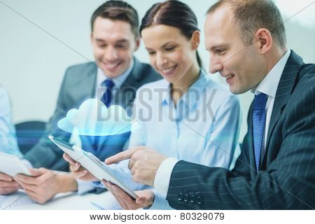 business, technology, cloud computing and people concept - smiling business team with tablet pc computer and virtual cloud projection having discussion in office