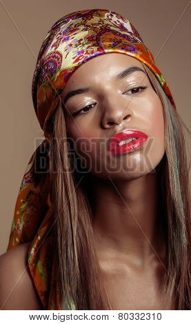 beauty young afro american woman in shawl on head smiling close
