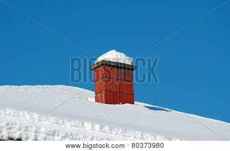 Rooftop Chimneys Under Snow