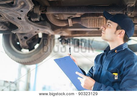 Portrait of a mechanic at work in his garage