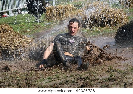 Man Falling In The Mud Squirted With Water