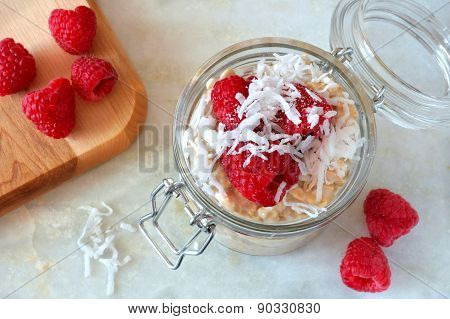 Breakfast refrigerator oatmeal with fresh raspberries and coconut