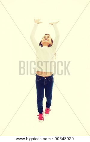Little pretty girl jumping with joy